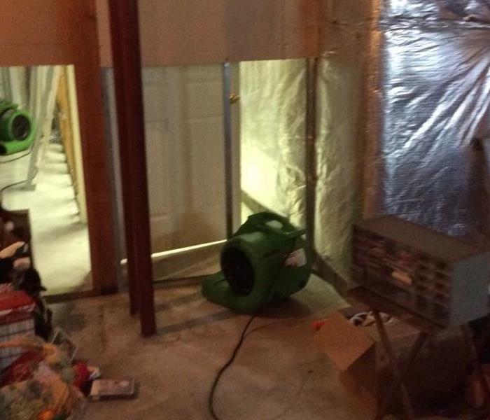 Room with flood cuts and green air movers. 