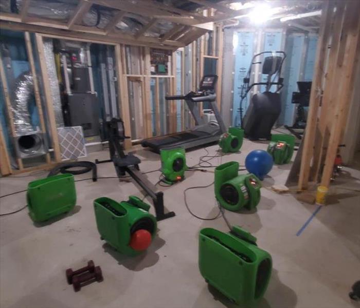 air movers set up in basement of home