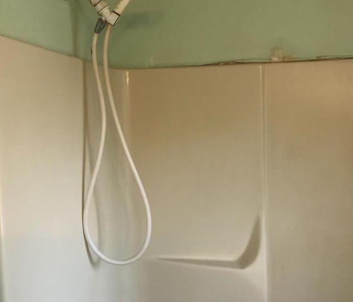 Cream colored fiberglass shower.